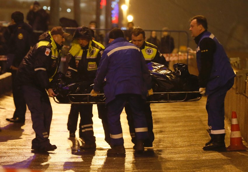 Medics carry the body of Boris Nemtsov, who was shot dead, in central Moscow
